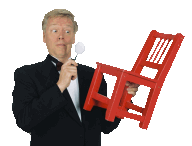 Norm inspecting a chair with a magnifying glass.